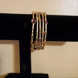 Set of 5 hammered gold tone bangles